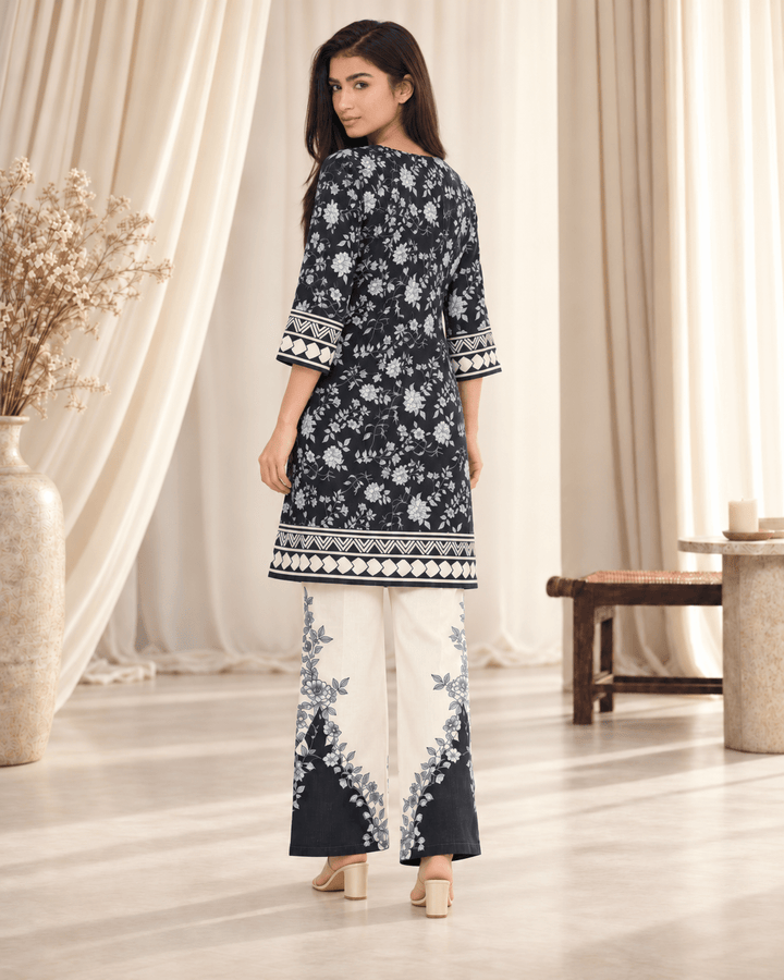 1 black and white stitched suit